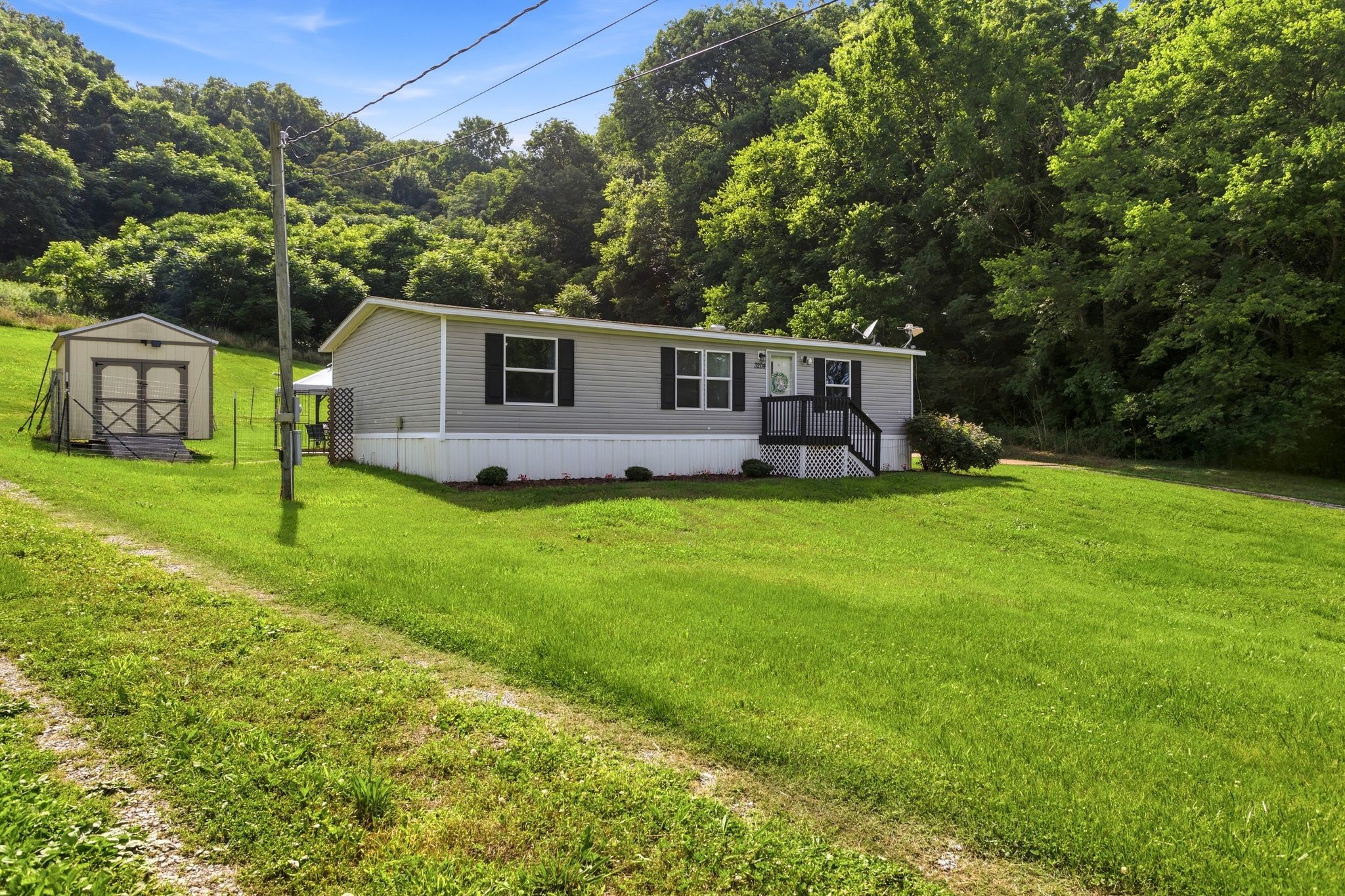 3204 Grizzly Road Culleoka, TN 38451 - Photo 2 of 25 a front view of house with yard and green space