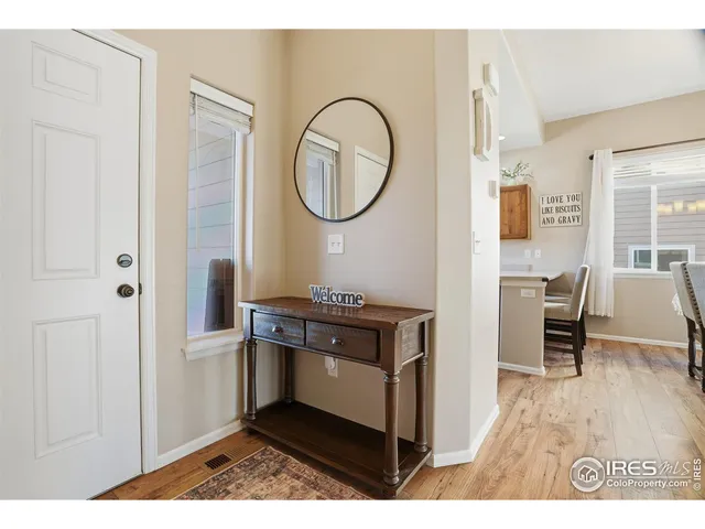 a living room with a table and a chair