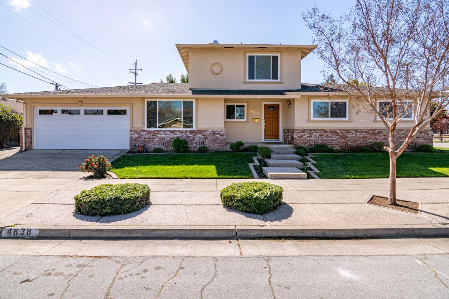 a house view with a garden space