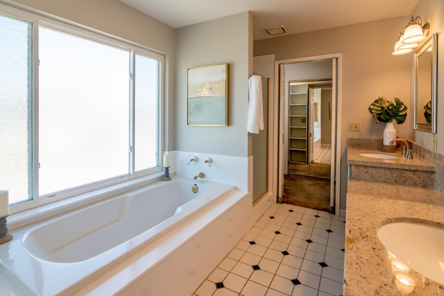 4638 Borina Drive San Jose, CA 95129 - Photo 14 of 24 a bathroom with a bathtub and a shower