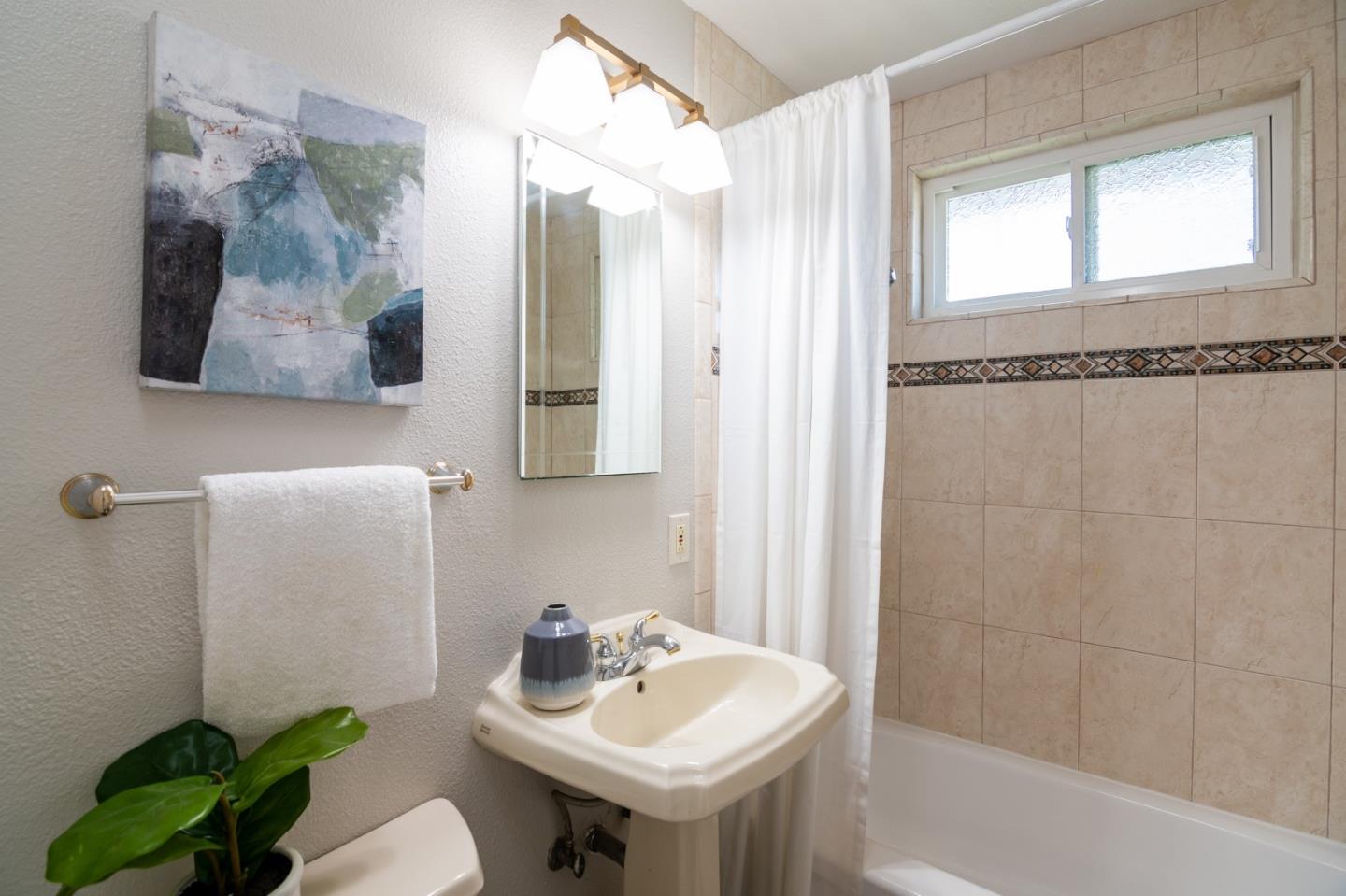 4638 Borina Drive San Jose, CA 95129 - Photo 16 of 24 a bathroom with a sink toilet and shower