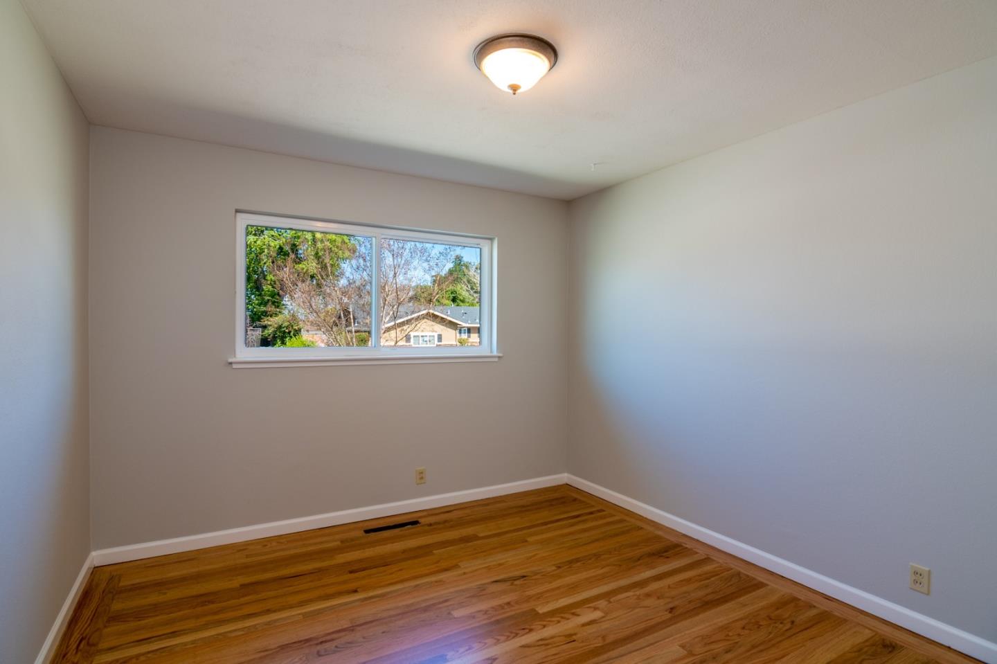 4638 Borina Drive San Jose, CA 95129 - Photo 18 of 24 a view of a room with wooden floor and window