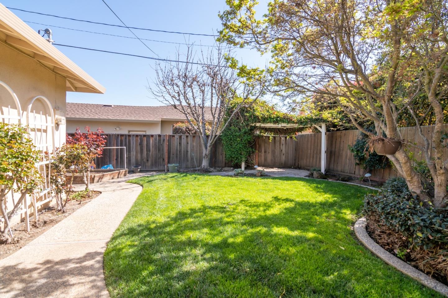 4638 Borina Drive San Jose, CA 95129 - Photo 21 of 24 a swimming pool with outdoor seating and yard