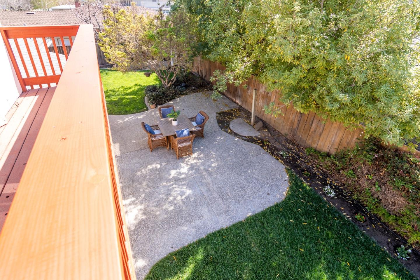 4638 Borina Drive San Jose, CA 95129 - Photo 22 of 24 a view of a backyard with couches under an umbrella