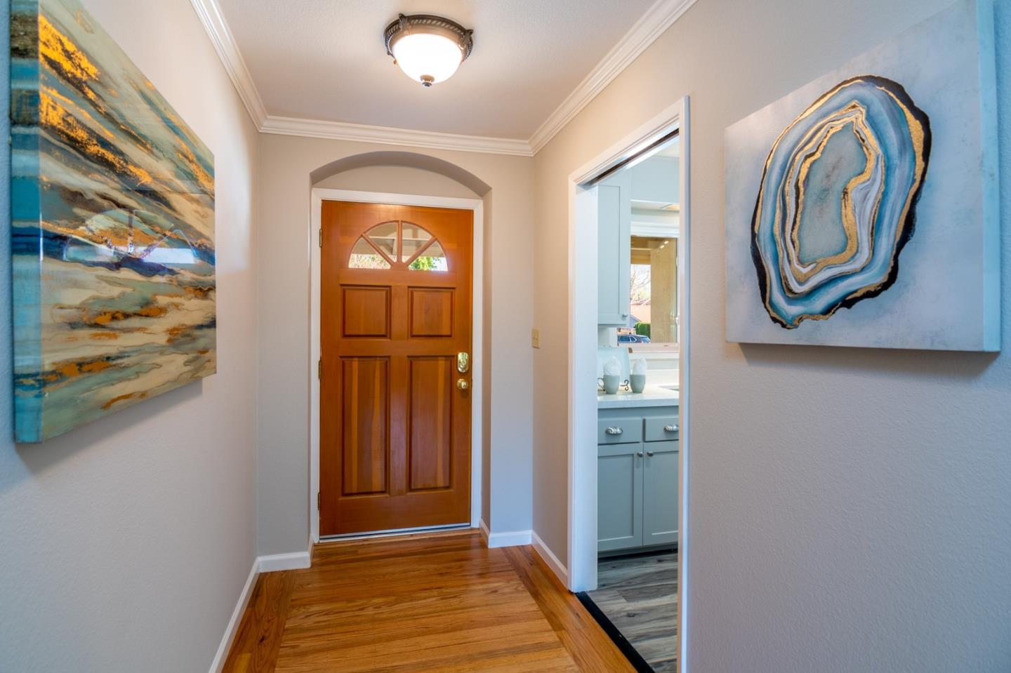 4638 Borina Drive San Jose, CA 95129 - Photo 3 of 24 a view of a hallway with entryway wooden floor and cabinet
