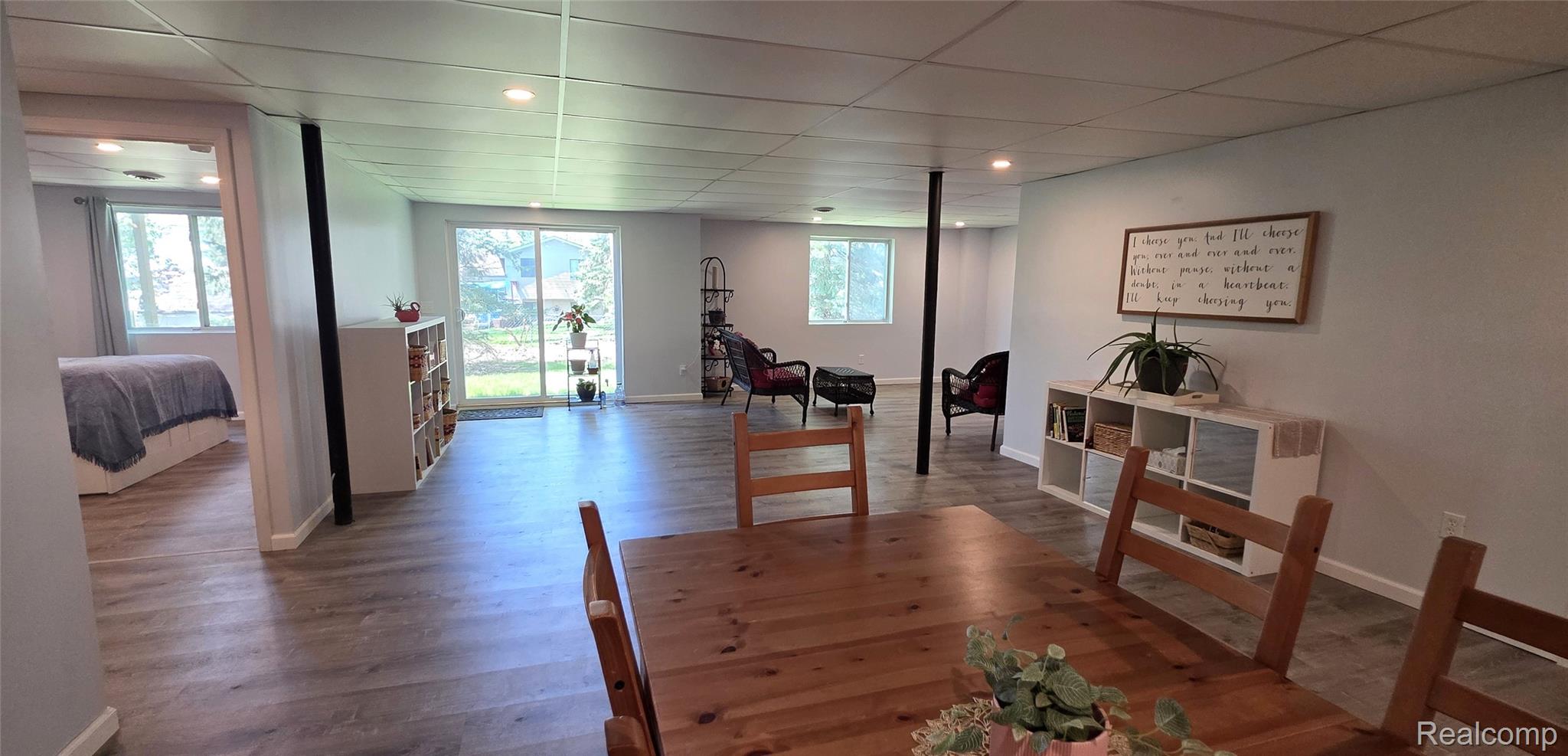814 Nelson's Ridge Drive Howell, MI 48843 - Photo 30 of 40 Basement with dark wood-style flooring and a drop ceiling