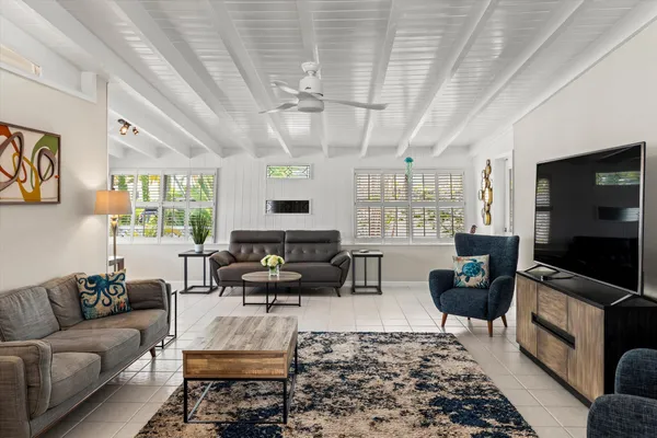a view of a dining table chairs and chandelier