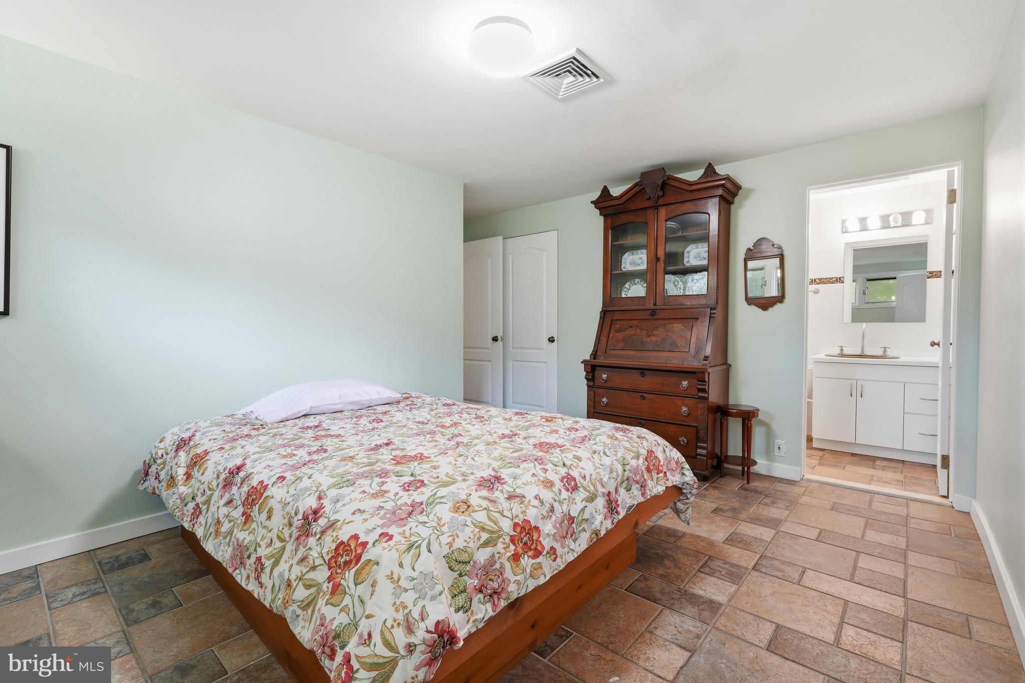 775 River Road Yardley, PA 19067 - Photo 34 of 75 Main level bedroom 1 with full ensuite bath