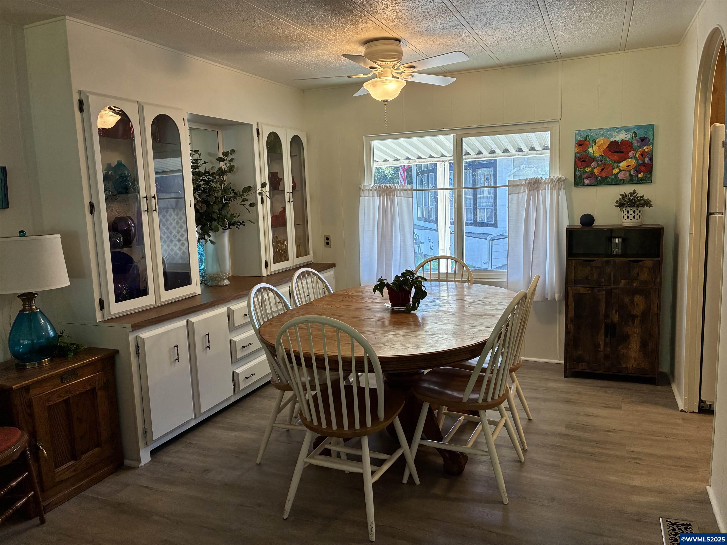 4915 Swegle Road Northeast, Unit 30 Salem, OR 97301 - Photo 11 of 31 a view of a dining room with furniture window and wooden floor