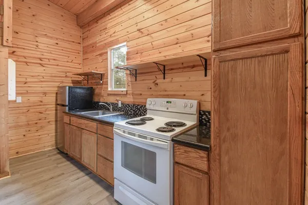 a kitchen with a stove and a microwave