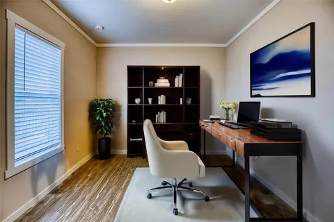 a bedroom with bed and a flat screen tv