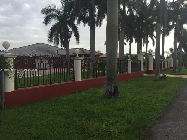 a view of a park with palm trees
