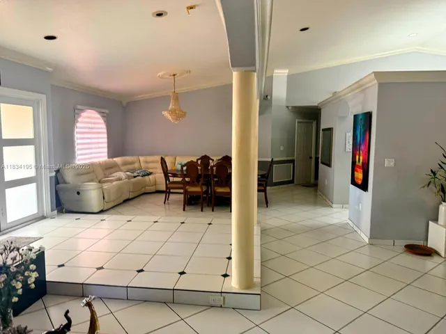 a bedroom with furniture and window