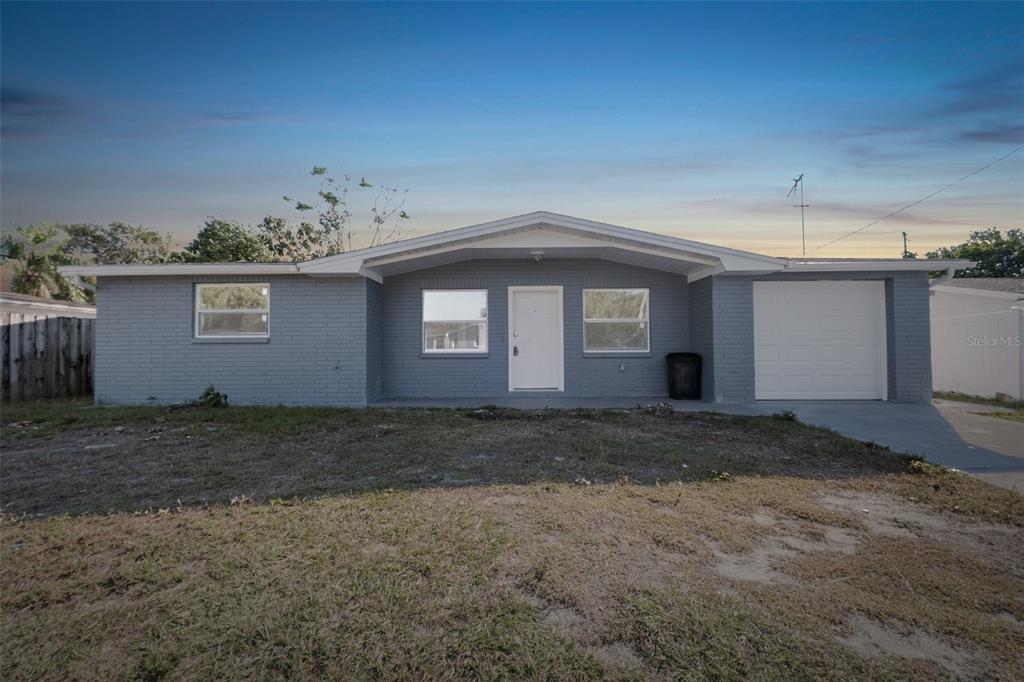 5404 Trouble Creek Road New Port Richey, FL 34652 - Photo 1 of 1 a view of a house with a yard
