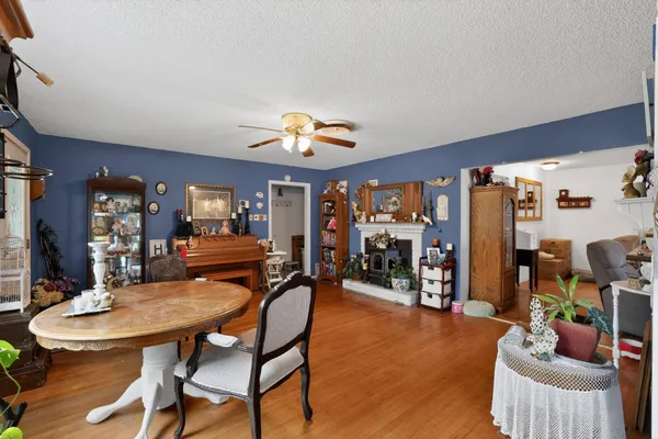 a view of a dining room with furniture and chandelier