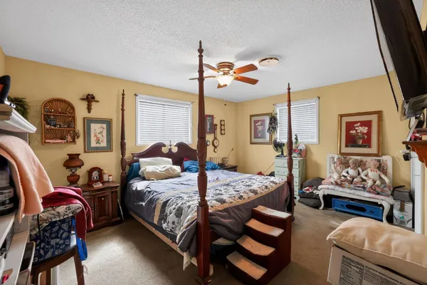 a bedroom with furniture and wooden floor
