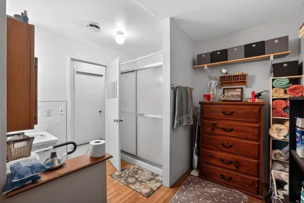 a view of bedroom with furniture and closet