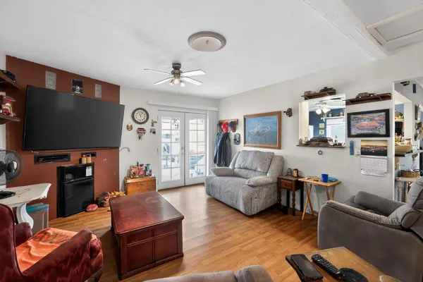a living room with furniture and a flat screen tv