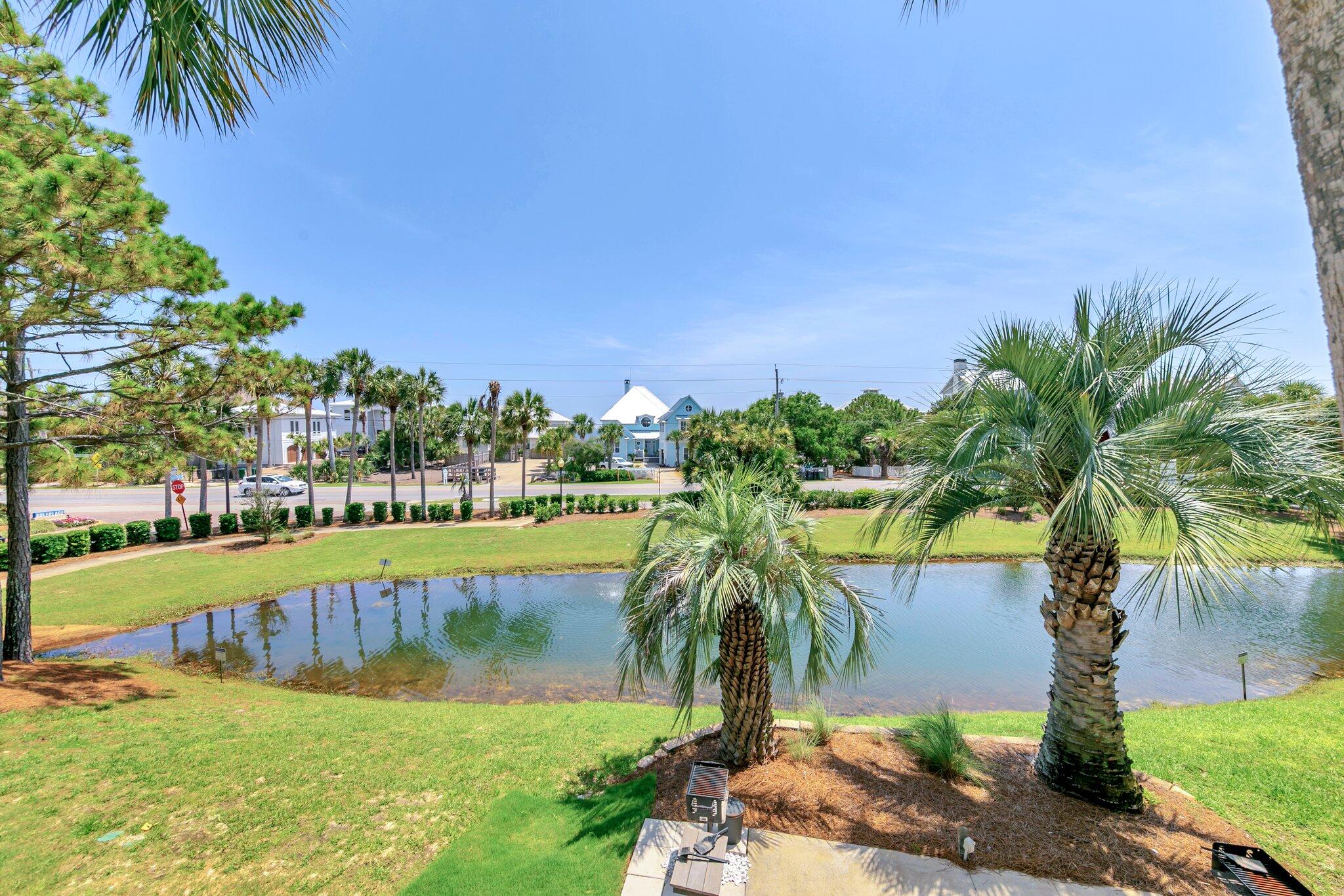 144 Spires Lane, Unit 202 Santa Rosa Beach, FL 32459 - Photo 27 of 31 a view of a swimming pool and a yard