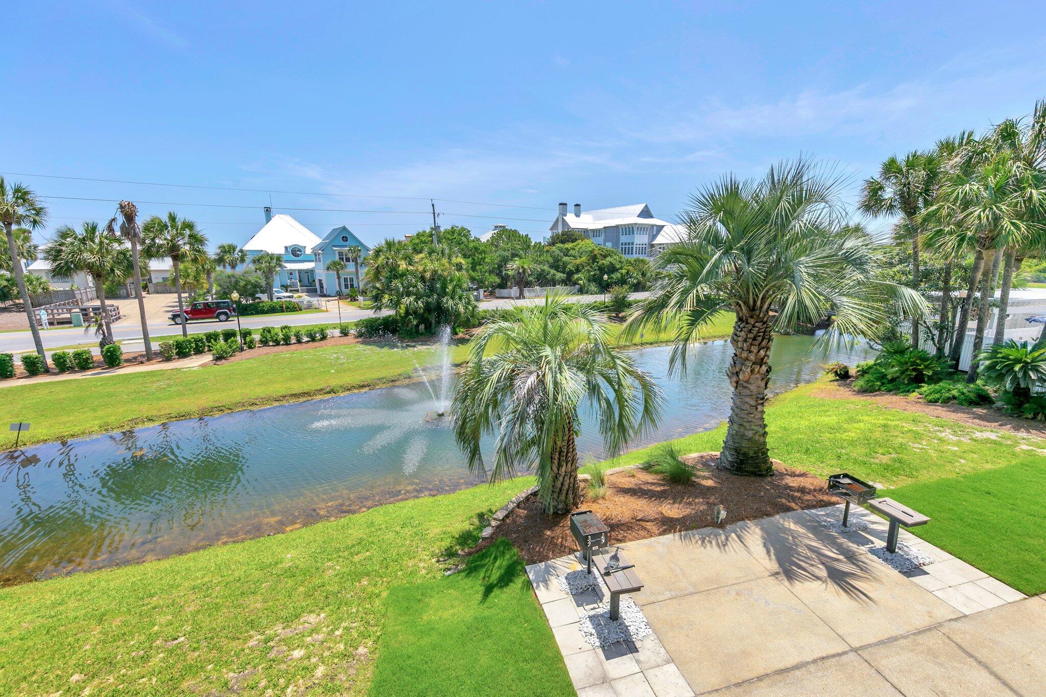 144 Spires Lane, Unit 202 Santa Rosa Beach, FL 32459 - Photo 29 of 31 a view of a lake and a yard