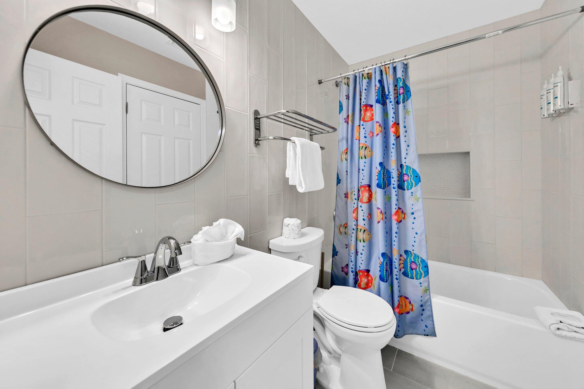 144 Spires Lane, Unit 202 Santa Rosa Beach, FL 32459 - Photo 5 of 31 a bathroom with a sink toilet and shower