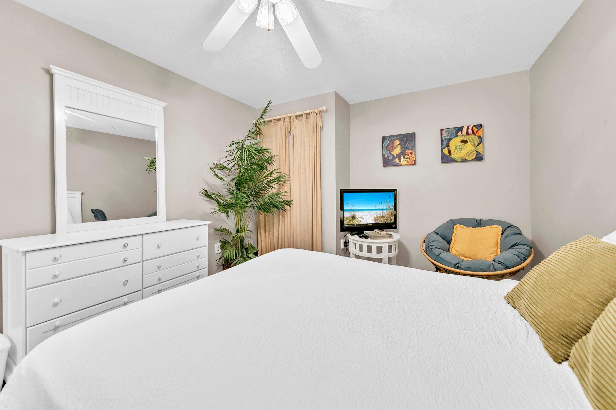 144 Spires Lane, Unit 202 Santa Rosa Beach, FL 32459 - Photo 7 of 31 a bedroom with a bed and a dresser