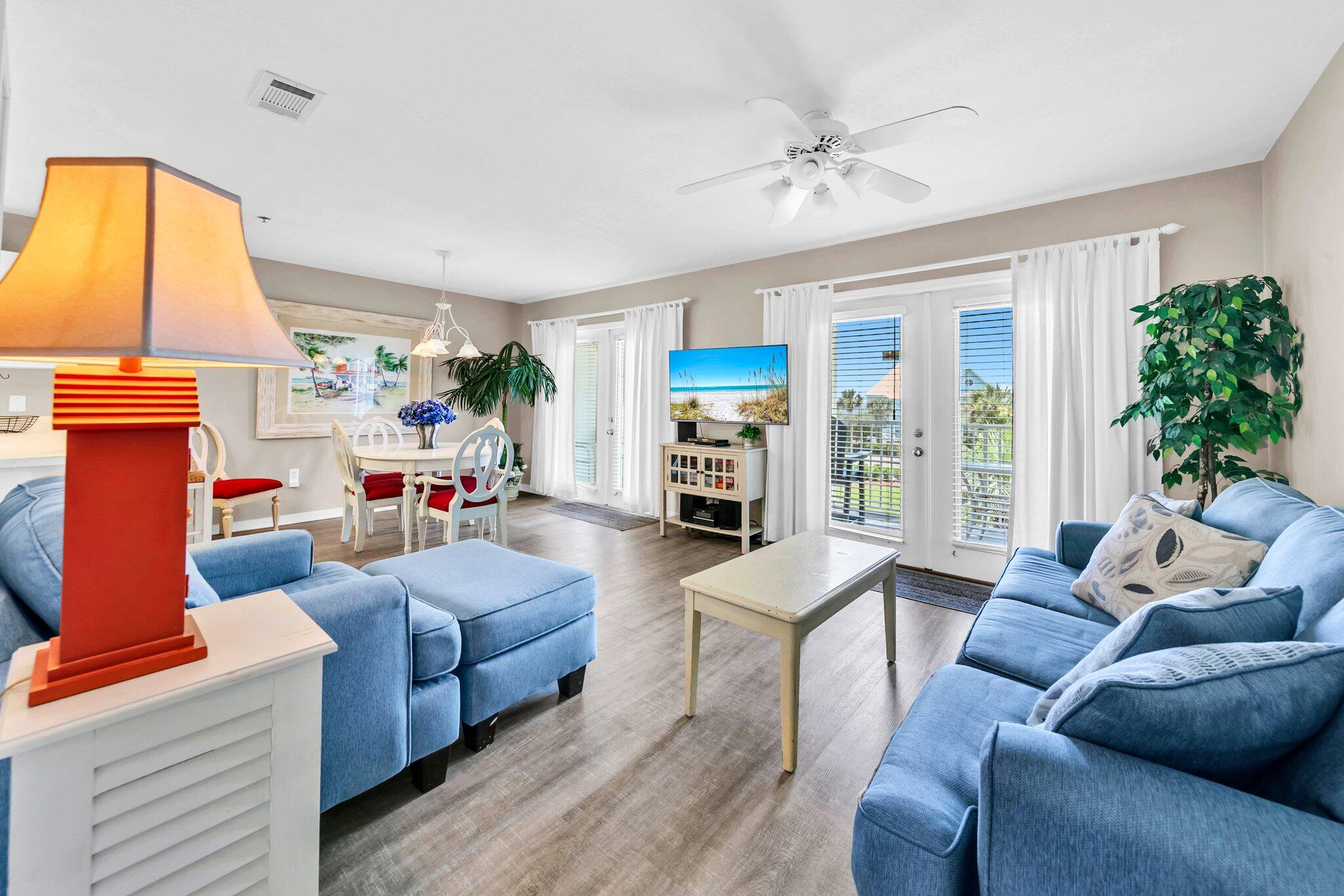 144 Spires Lane, Unit 202 Santa Rosa Beach, FL 32459 - Photo 10 of 31 a living room with furniture fireplace and a large window