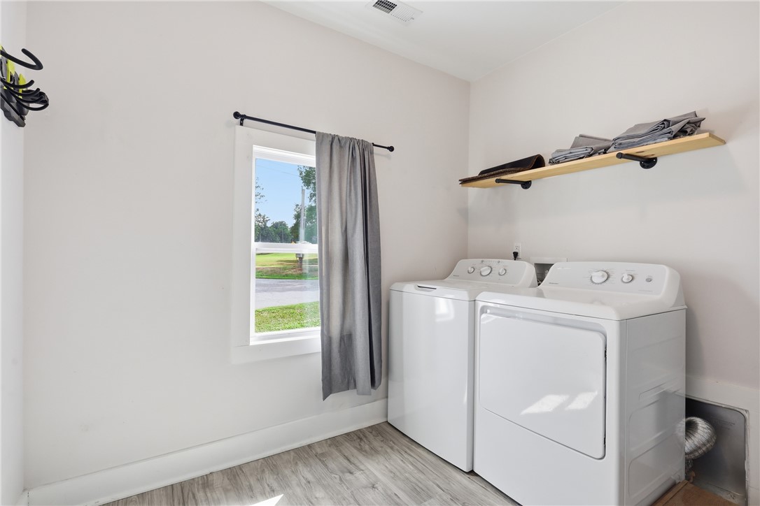 1 Brock Street Pelzer, SC 29669 - Photo 22 of 25 A well-lit laundry area with durable flooring and convenient overhead shelving.