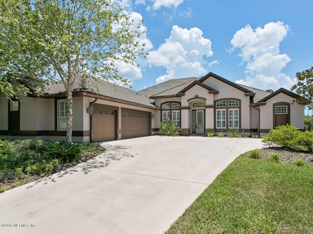 2048 River's Own Road St. Augustine, FL 32092 - Photo 1 of 38 a front view of a house with garden