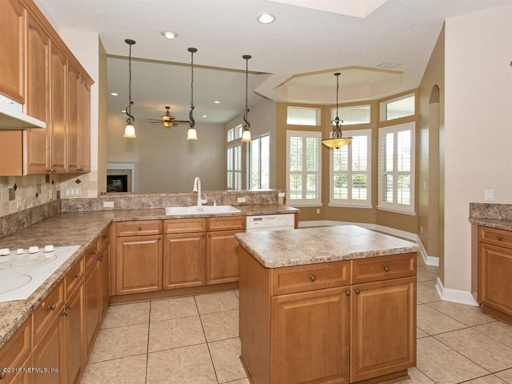2048 River's Own Road St. Augustine, FL 32092 - Photo 11 of 38 a kitchen with a sink stove and cabinets