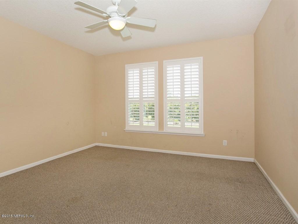 2048 River's Own Road St. Augustine, FL 32092 - Photo 16 of 38 an empty room with a window and a fan