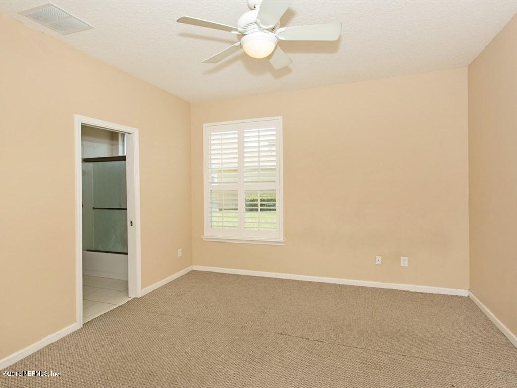 2048 River's Own Road St. Augustine, FL 32092 - Photo 18 of 38 a view of an empty room with a window