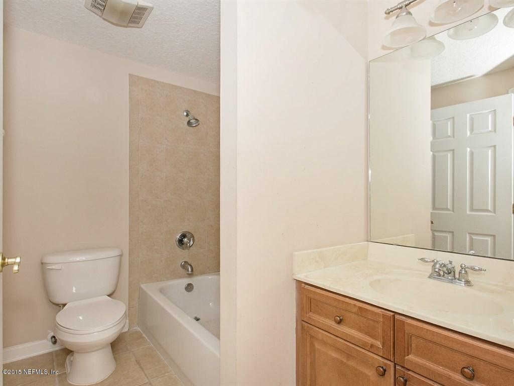 2048 River's Own Road St. Augustine, FL 32092 - Photo 22 of 38 a bathroom with a sink a toilet and shower