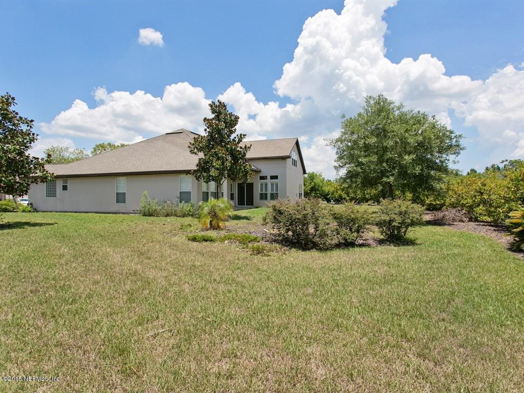 2048 River's Own Road St. Augustine, FL 32092 - Photo 26 of 38 a front view of a house with garden