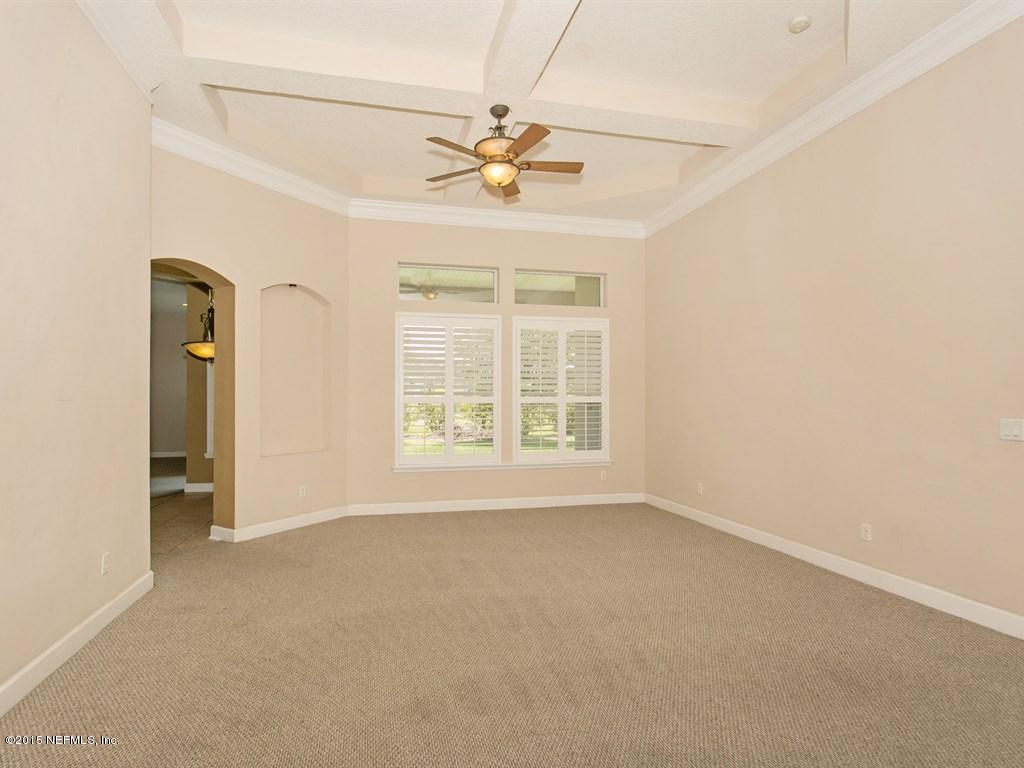 2048 River's Own Road St. Augustine, FL 32092 - Photo 3 of 38 an empty room with a ceiling fan and window