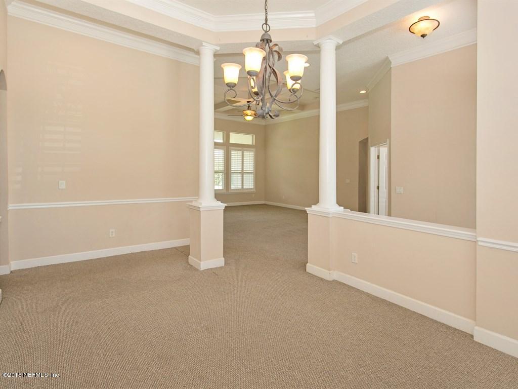2048 River's Own Road St. Augustine, FL 32092 - Photo 5 of 38 a view of an empty room with window and chandelier fan
