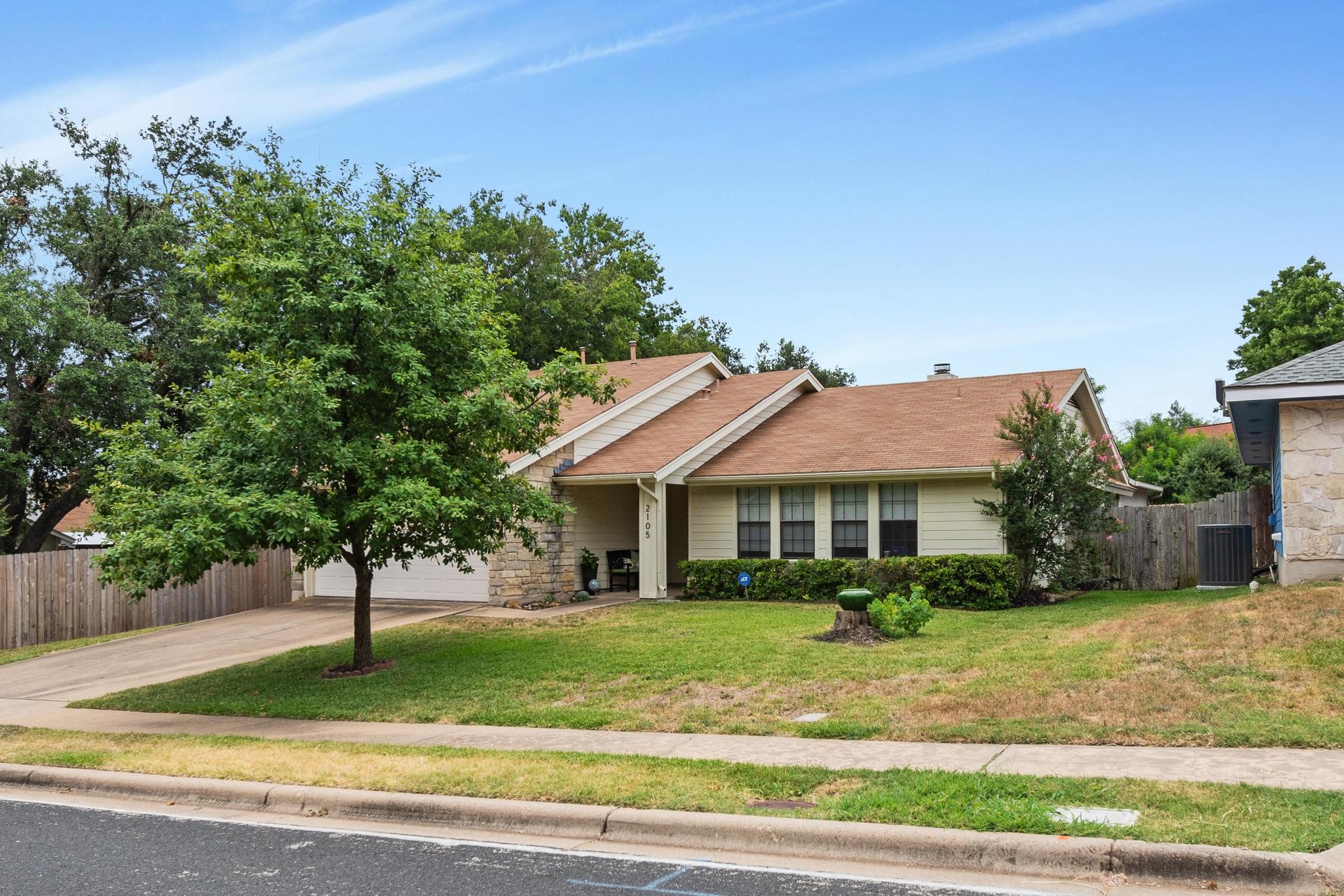 2105 Delvin Lane Austin, TX 78728 - Photo 1 of 1 a front view of a house with a yard