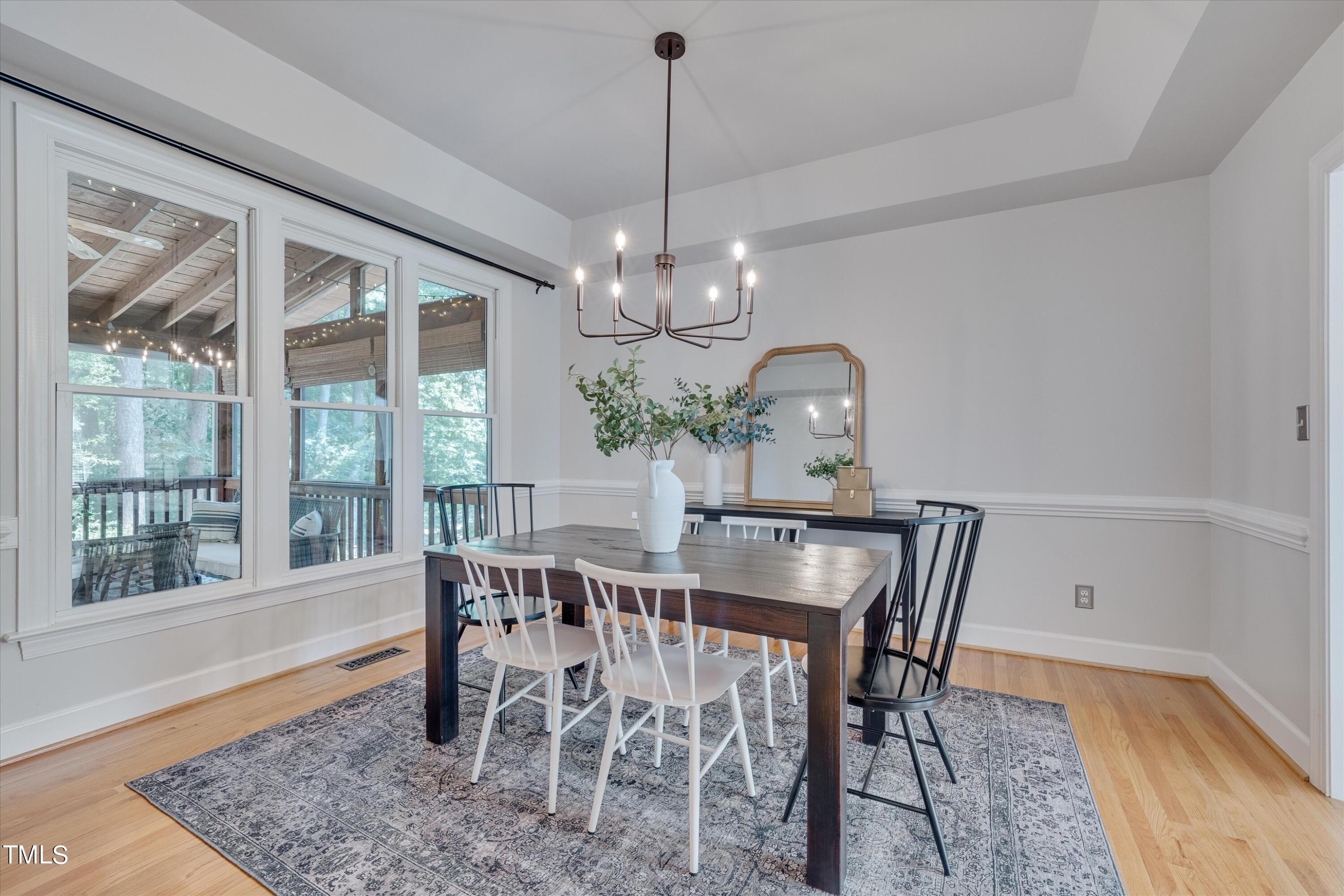 116 Ashworth Drive Durham, NC 27707 - Photo 18 of 60 a view of a dining room with furniture window and wooden floor