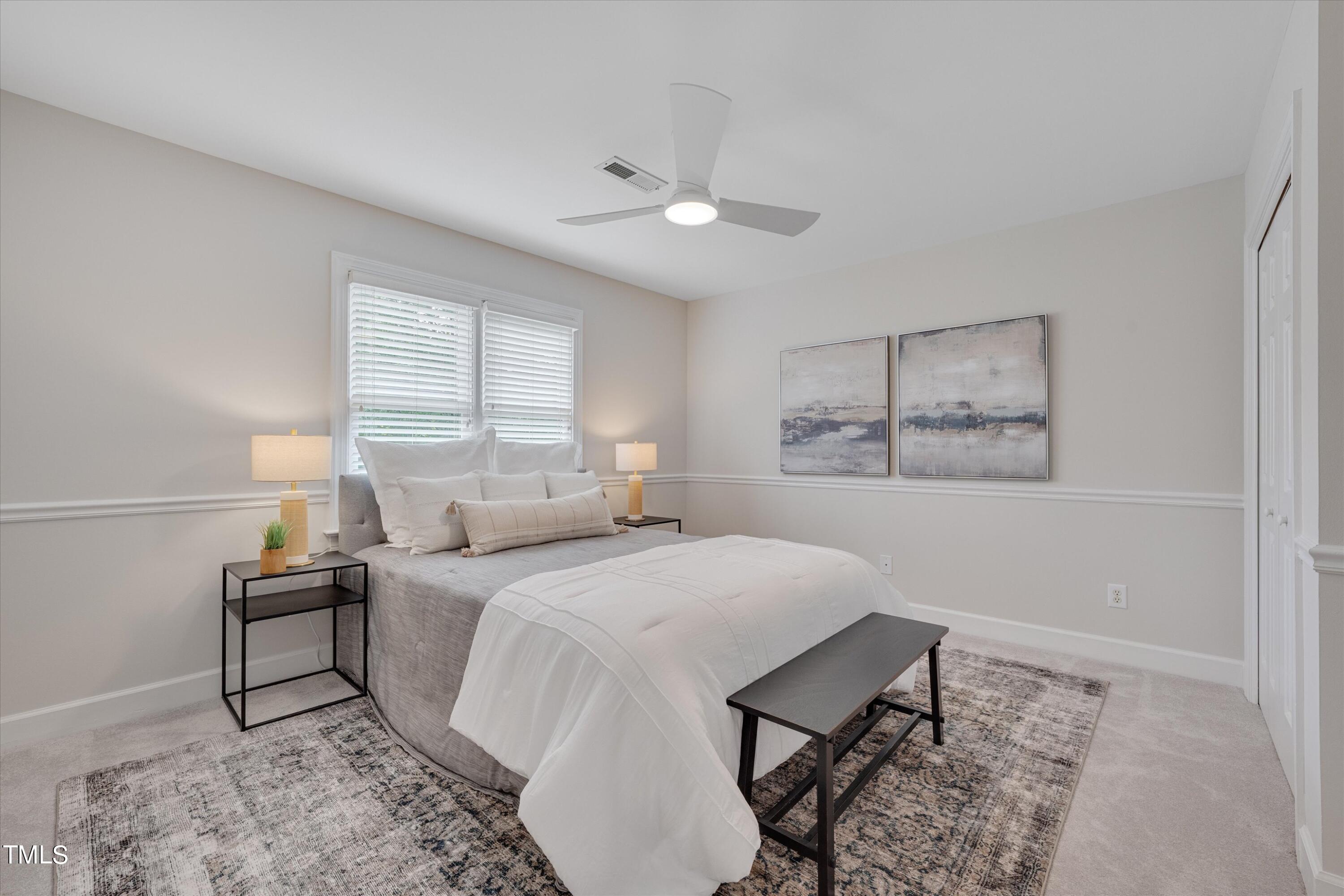 116 Ashworth Drive Durham, NC 27707 - Photo 28 of 60 a bedroom with a bed and a window