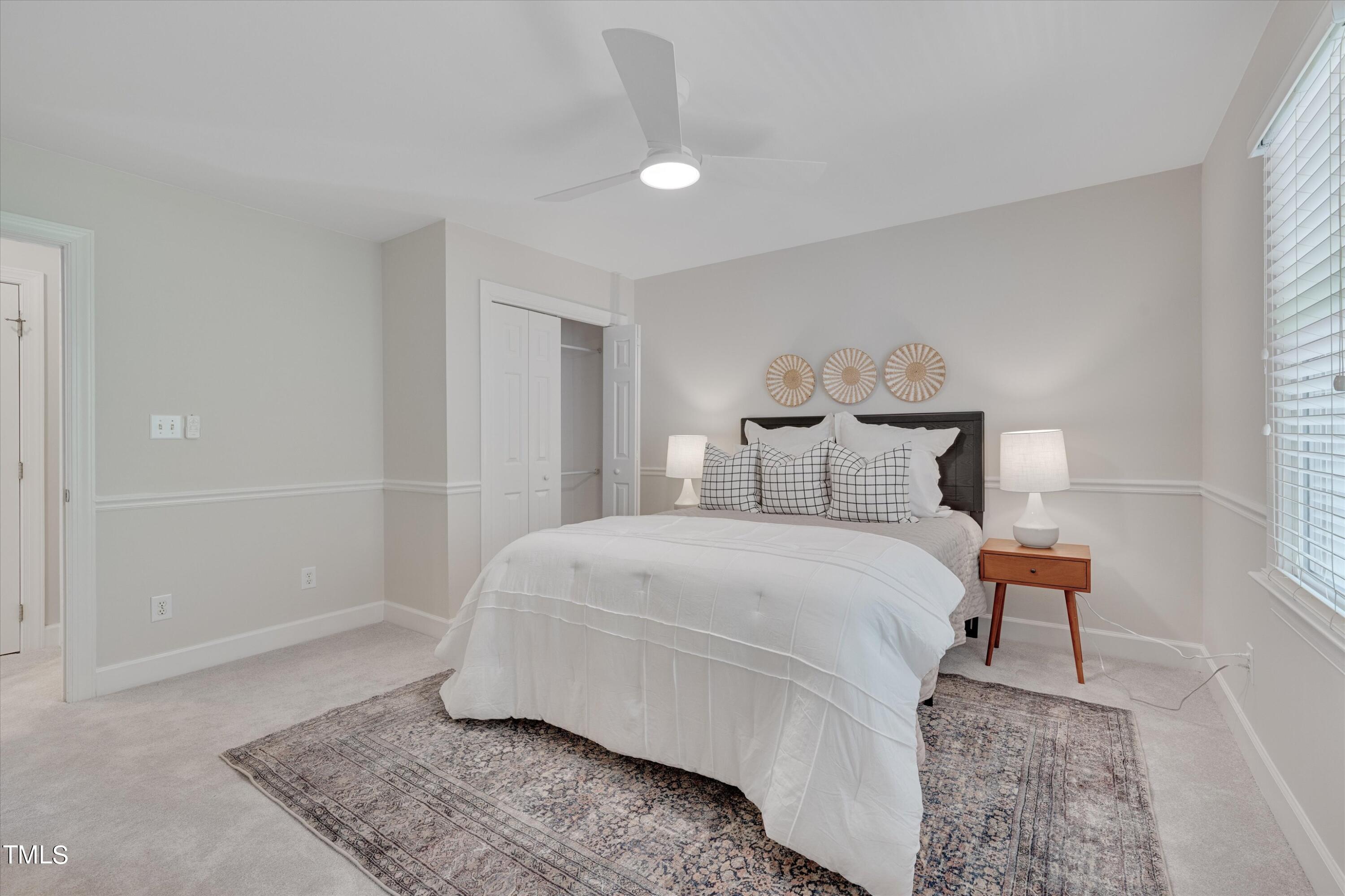 116 Ashworth Drive Durham, NC 27707 - Photo 31 of 60 a bedroom with a bed and a window