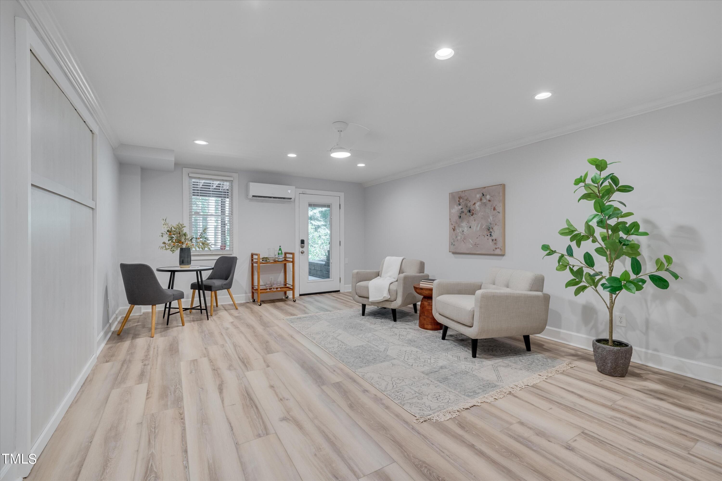 116 Ashworth Drive Durham, NC 27707 - Photo 34 of 60 a living room with furniture and a potted plant
