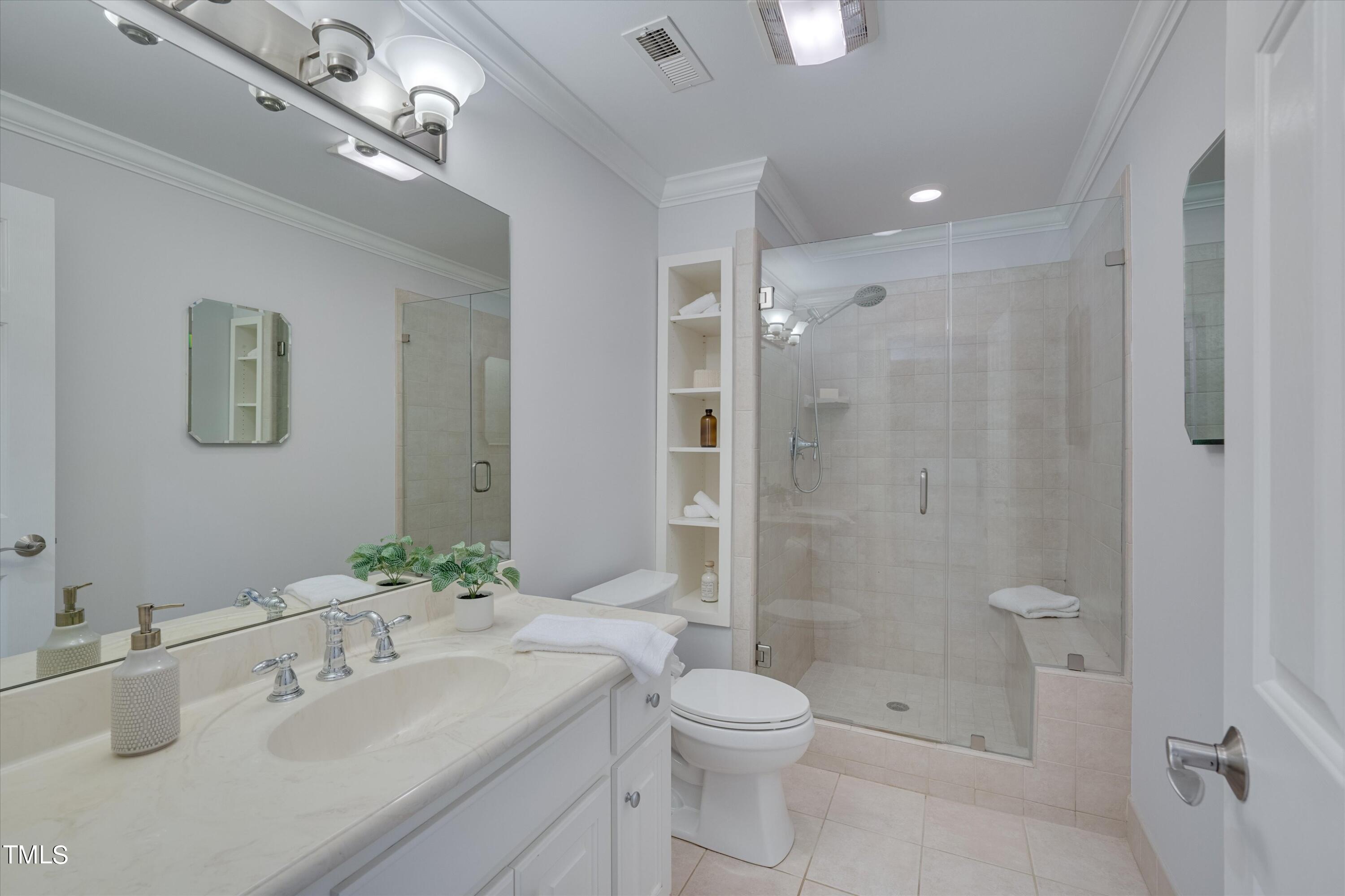 116 Ashworth Drive Durham, NC 27707 - Photo 35 of 60 a bathroom with a sink a toilet and shower