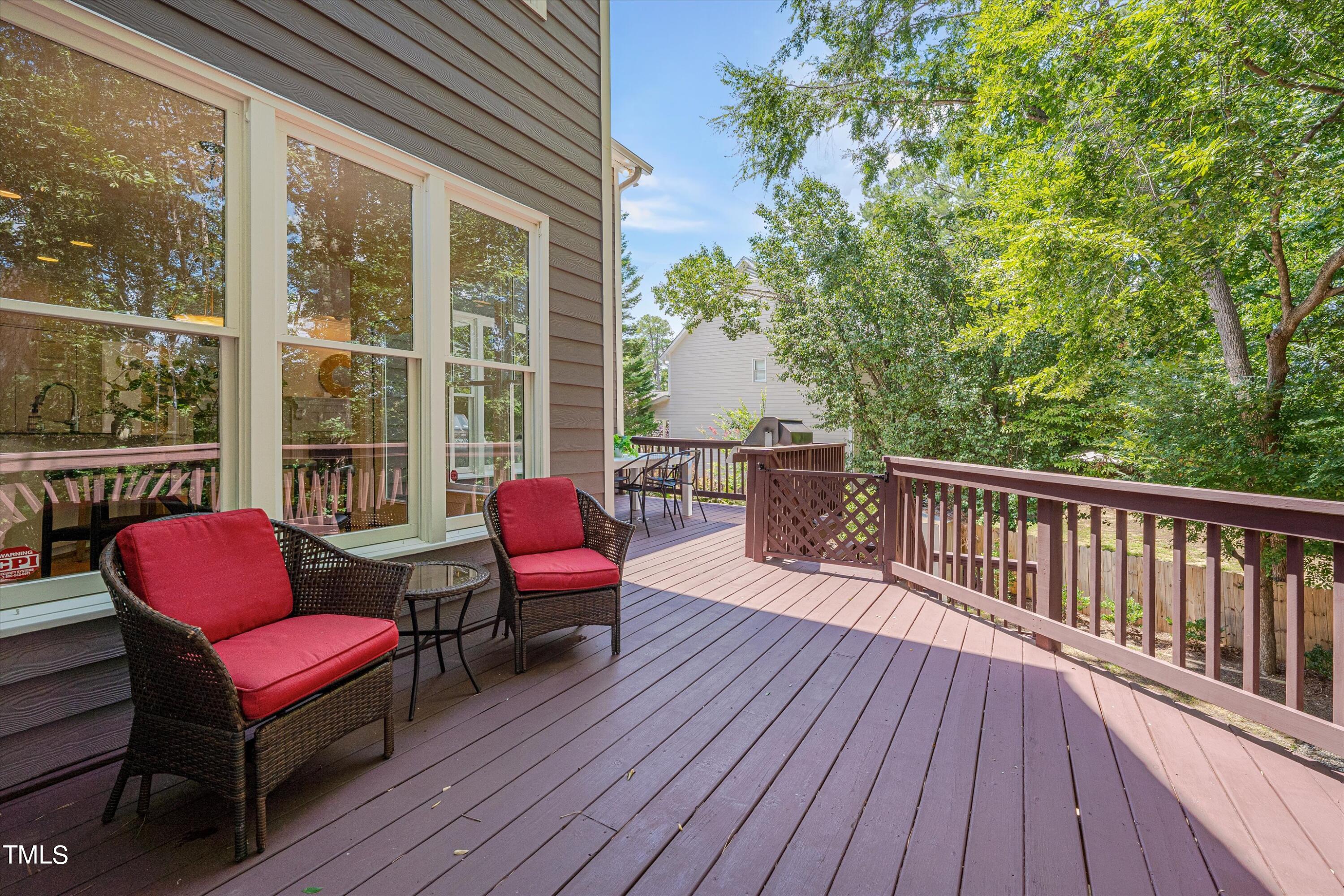 116 Ashworth Drive Durham, NC 27707 - Photo 42 of 60 a balcony with wooden floor table and chairs