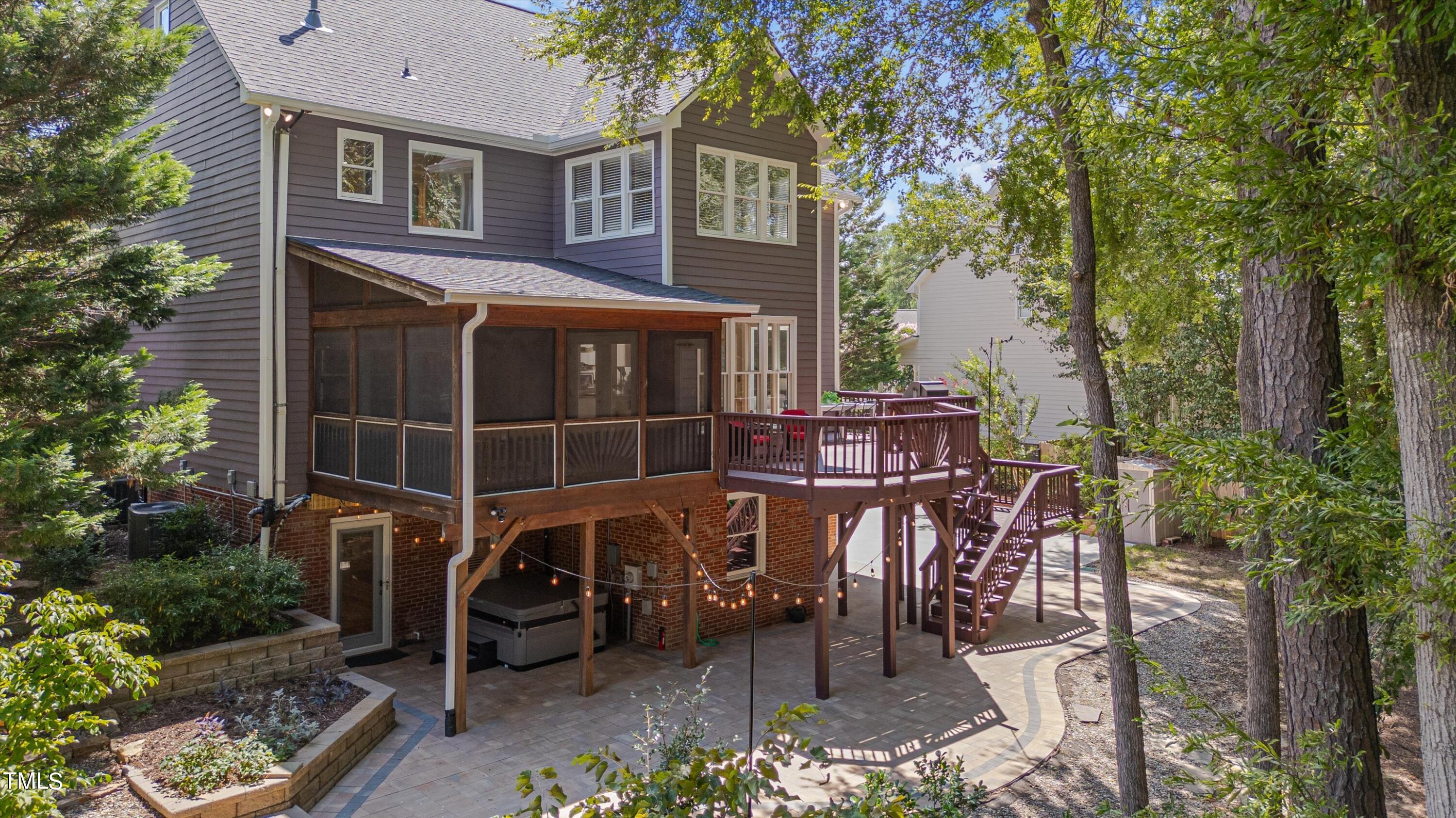116 Ashworth Drive Durham, NC 27707 - Photo 43 of 60 a view of a patio with table and chairs and potted plants with wooden fence