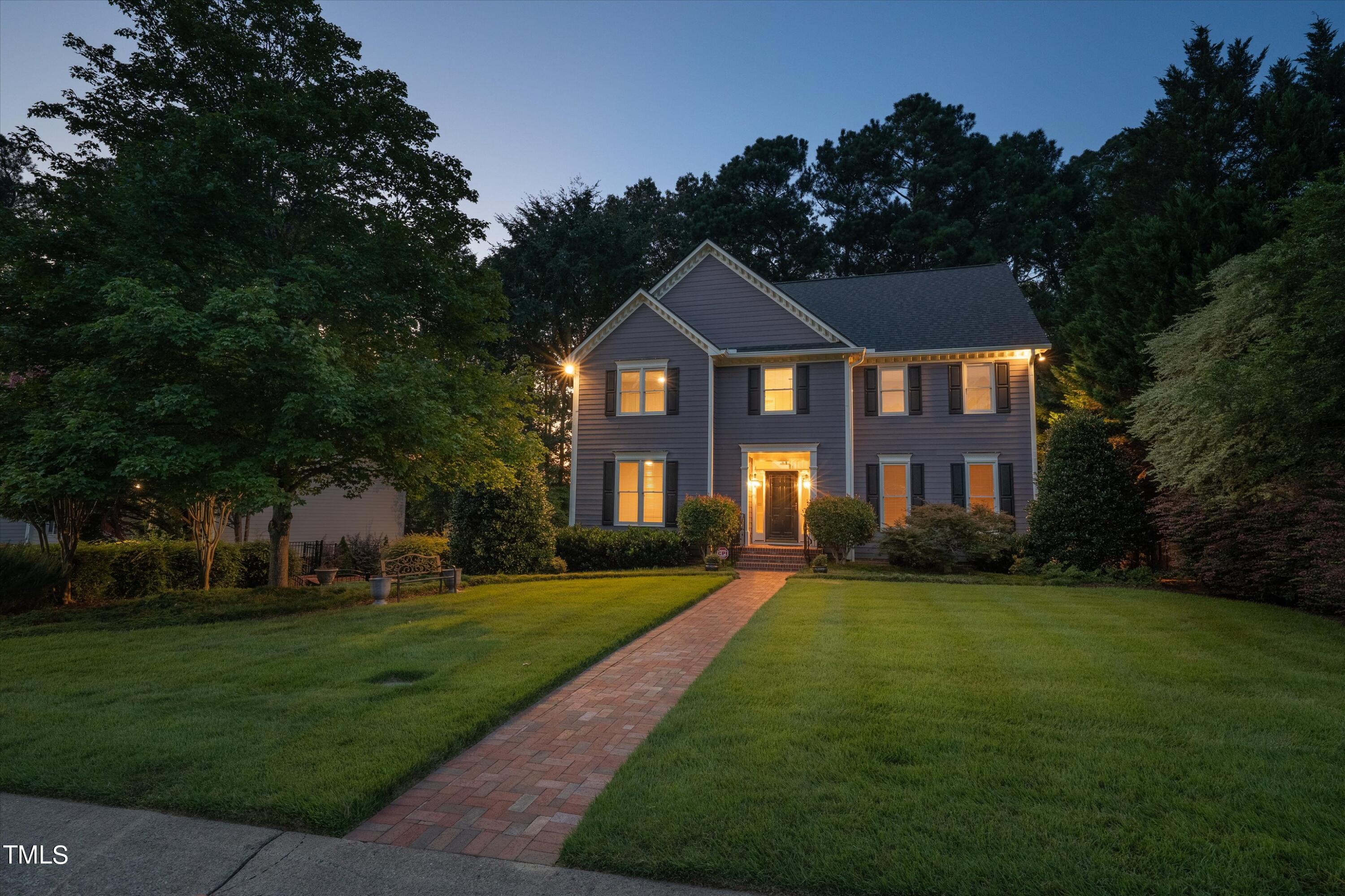 116 Ashworth Drive Durham, NC 27707 - Photo 57 of 60 a front view of a house with a yard