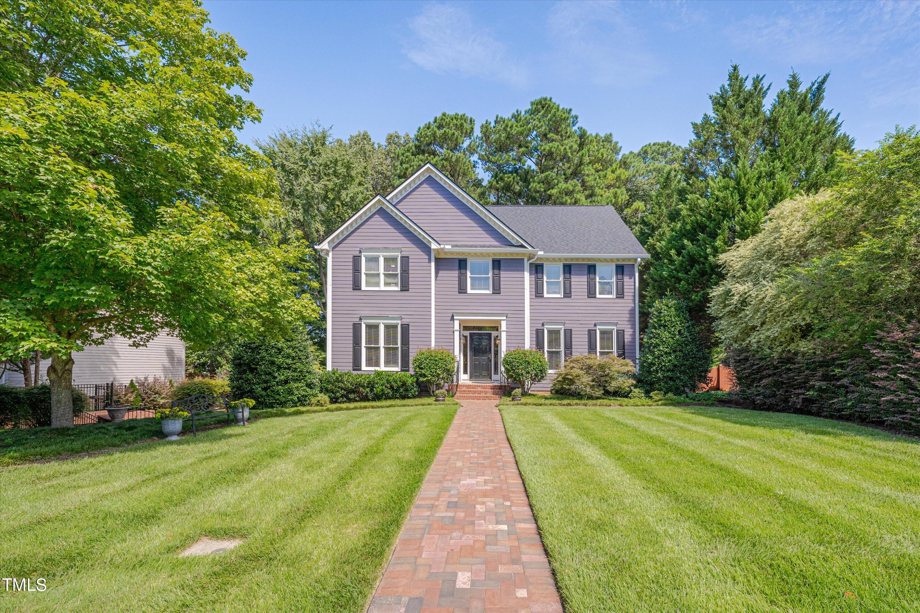 116 Ashworth Drive Durham, NC 27707 - Photo 9 of 60 a view of house in front of a big yard with large trees