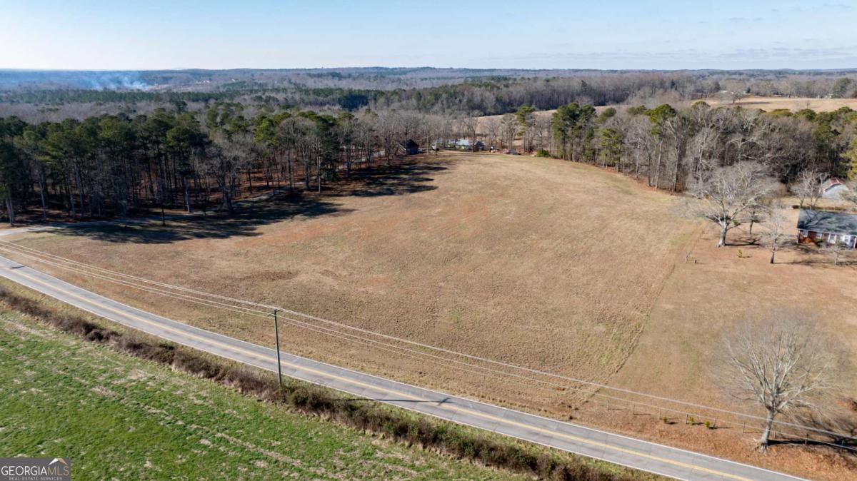 0 Old Centerpoint Road Carrollton, GA 30117 - Photo 4 of 11 a view of a dry yard with wooden fence