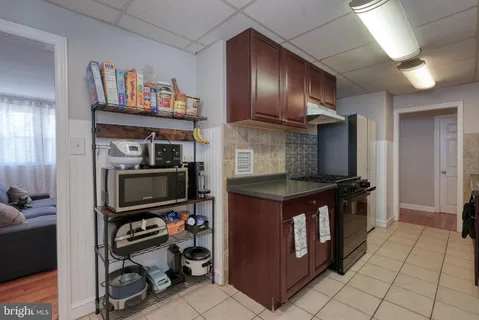 a kitchen with stainless steel appliances granite countertop a stove and a refrigerator