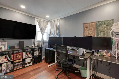 a room with furniture and a flat screen tv