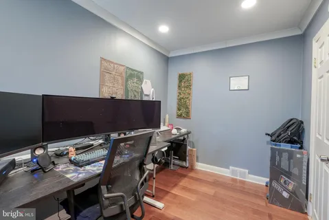 a view of a workspace with furniture and rug